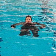 swimmer treading water in boiler suit