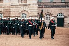 A drill instructor in the front, leading everyone behind.