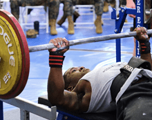 A man lifting weights on a bench press
