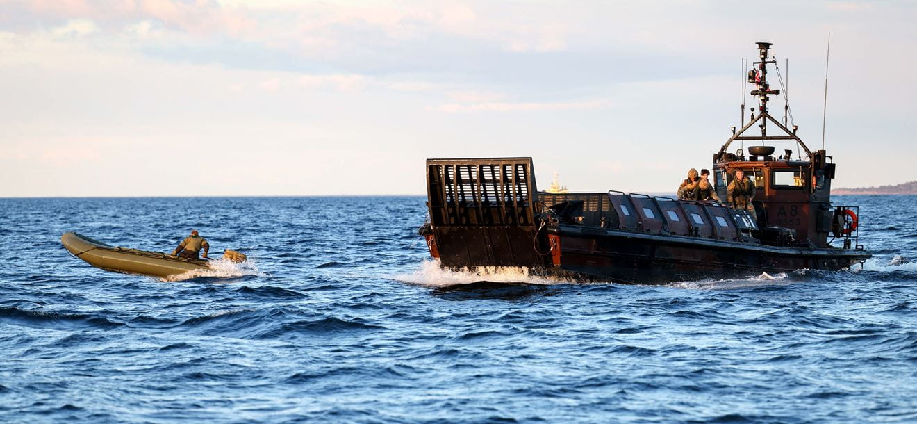 Royal Marine Commandos launching and recovering small boats of commandos from HMS Albion’s large Aft gate