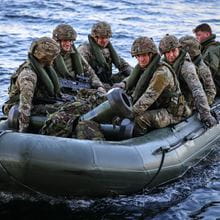 Royal Marine Commandos launching and recovering small boats of commandos from HMS Albion’s large Aft gate