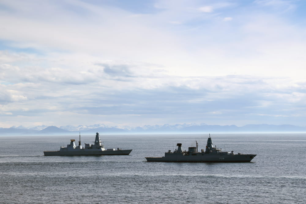 AN image of two ships from far away
