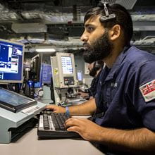Royal-Navy-Our-People-Leadership-08-leading.jpg Royal Navy sailor works at computer in Operations Room