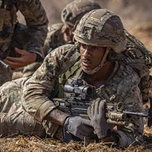 Royal Marine with gun in live firing range