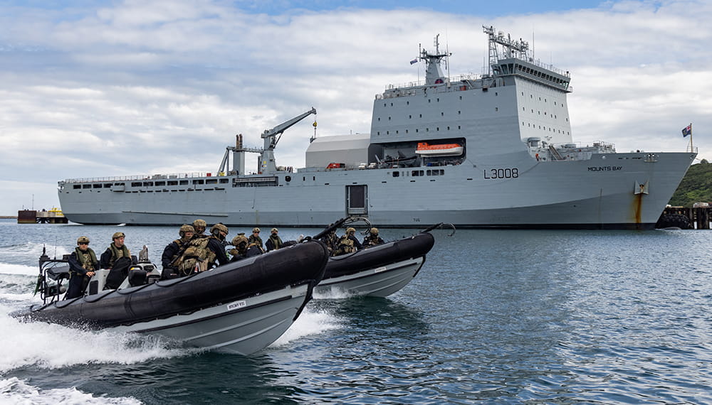 Royal-Navy-What-we-do-protect-04-protecting-our-economy.jpg Two Royal Navy ribs speed past RFA Mounts Bay