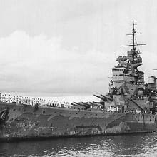 A black-and-white photo of the battleship HMS Prince of Wales.
