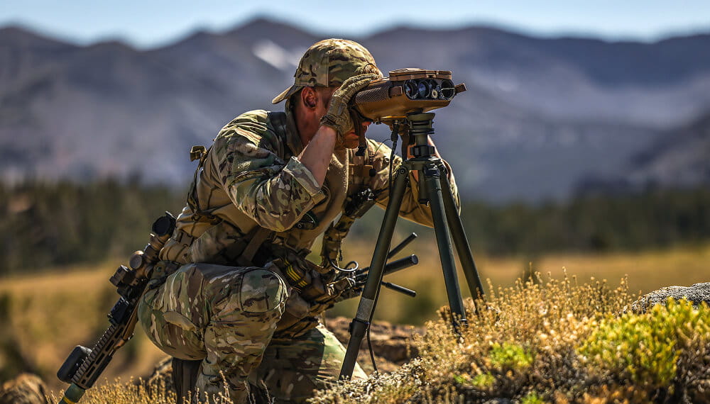 Royal Marine on location using binoculars 