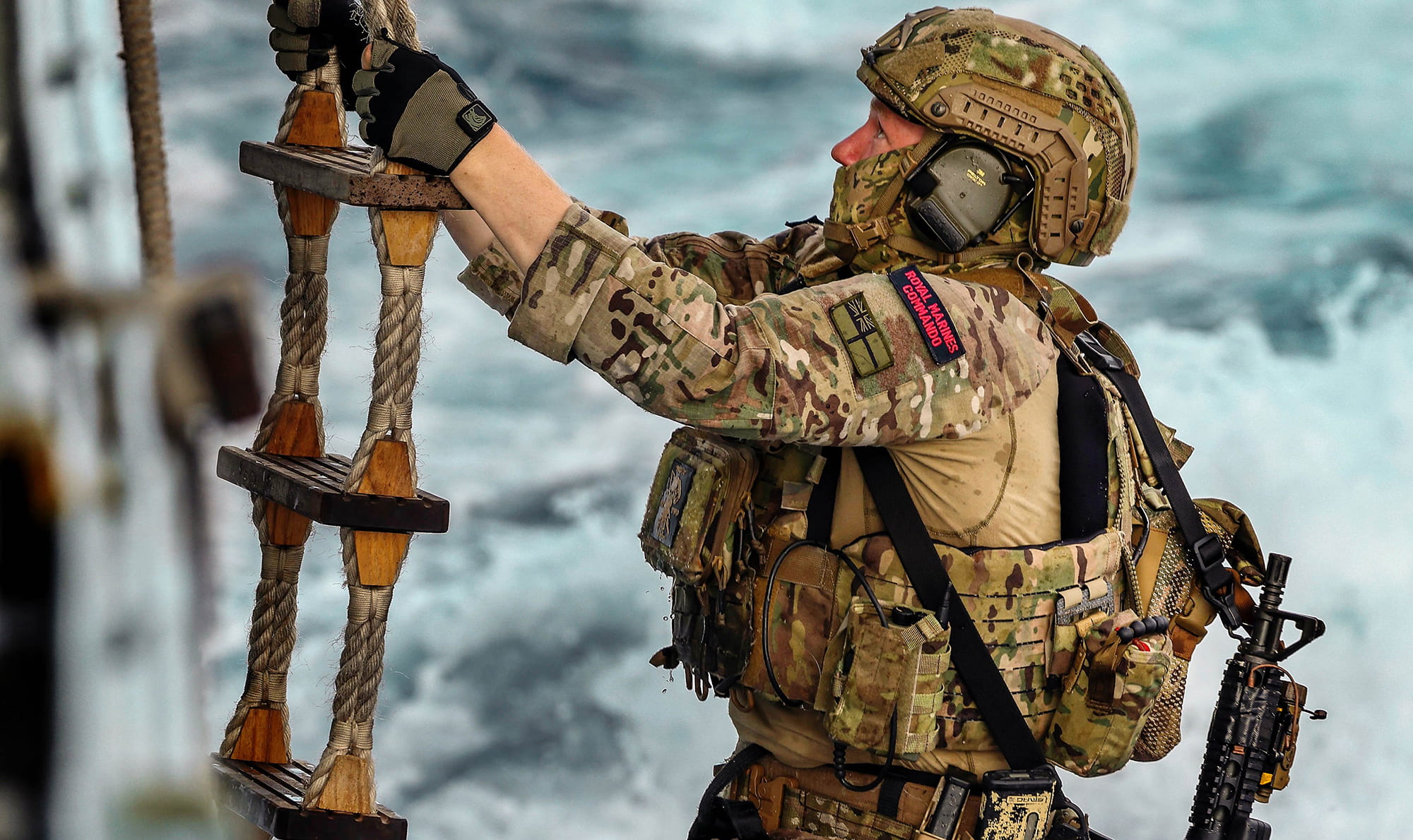 royal-navy-careers-royal-marines-joining-process-01 A Royal marine commando climbs a pilot ladder during a “self” boarding exercise on HMS Kent. HMS Kent conducts boarding training. HMS Kent took part in boarding training whilst in the Indo-Pacific region.