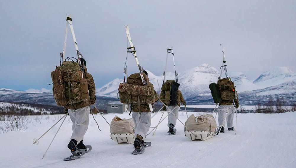royal-navy-careers-life-in-the-royal-marines-07 Royal marines winter deployment. Commando forces yomping on snow shoes and carrying their skis during their Cold Weather Winter Warfare Course near Skjold.