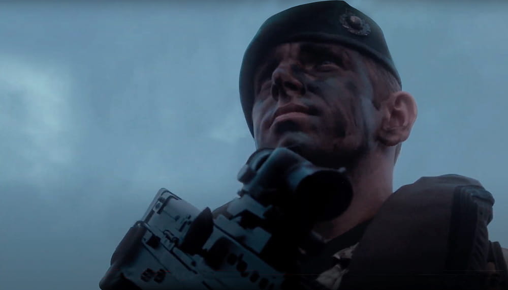 A close up of a Marine holding a pice of kit