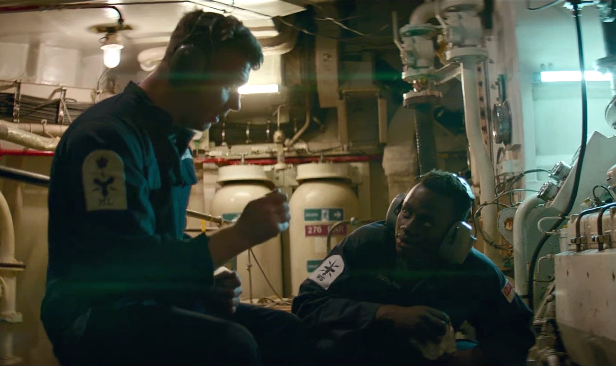Royal Navy personnel discuss a task