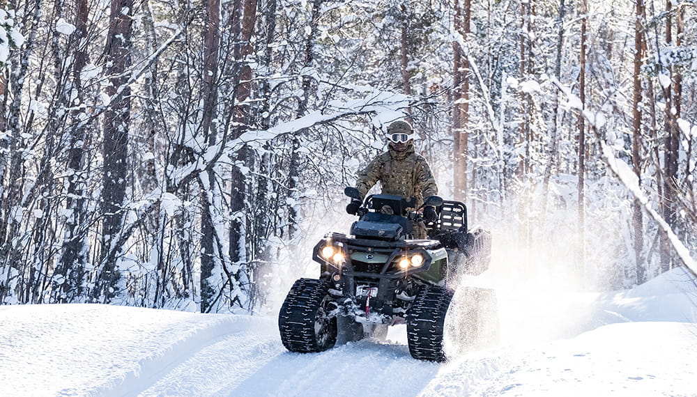 Royal-Navy-Equipment-Commando-By-Land-03-Quad-Bike Royal Marine riding a Can-Am Outlander 6x6 ATV