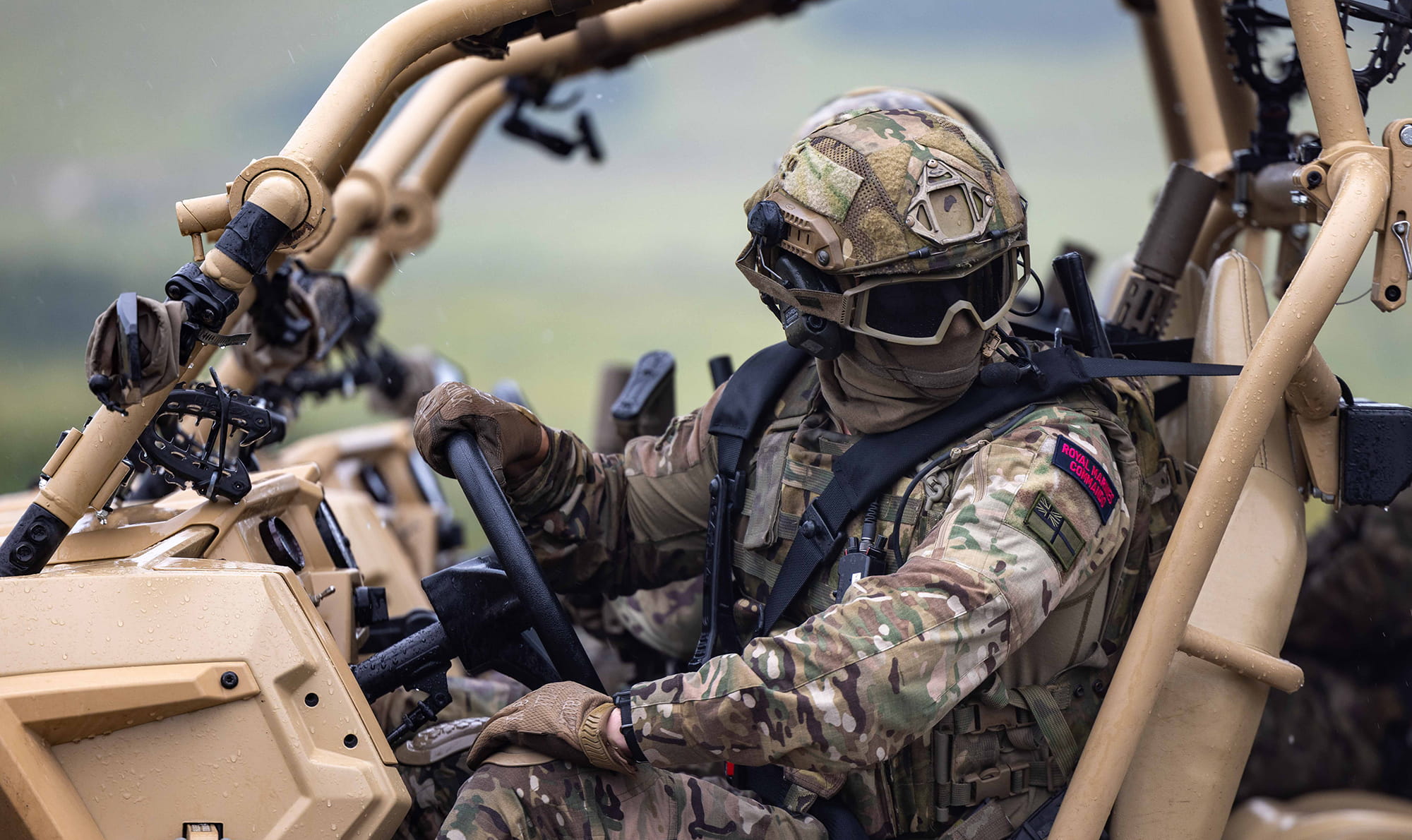 Equipment-Overview-04-Royal-Marines Royal Marine with face covered sat in a Polaris MRZR-D4