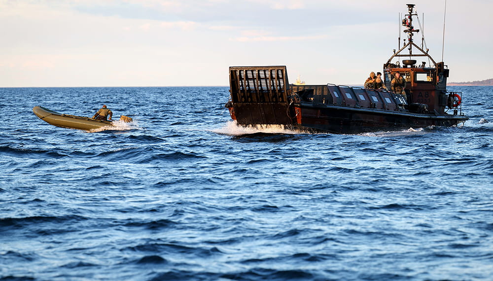 Royal Navy inflatable and small landing craft at sea