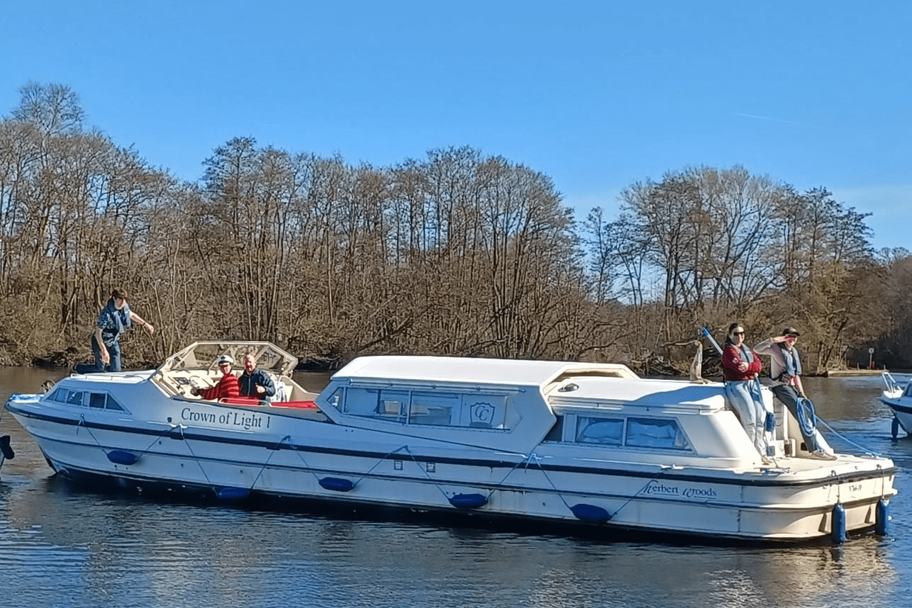 URNU Cambridge on a boat