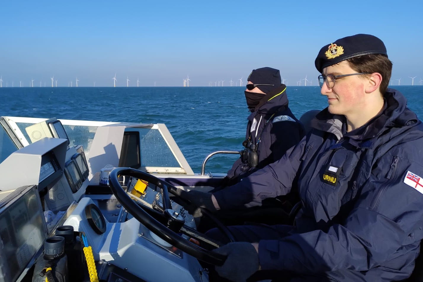 URNU member driving boat