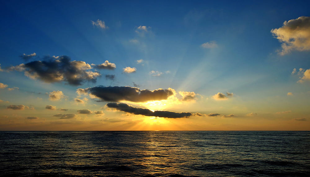 A context image of a sunrise at sea
