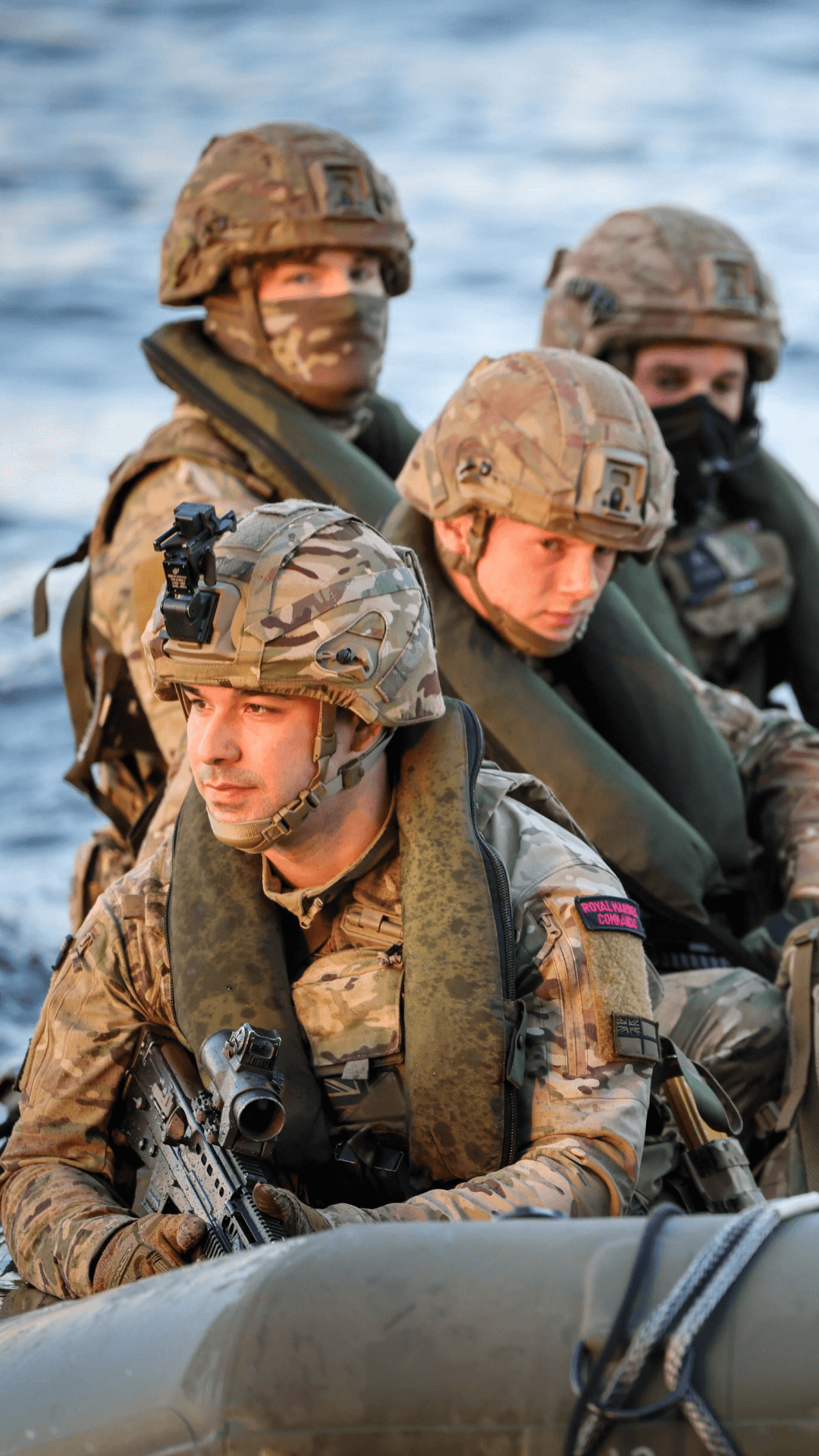 Royal marines on rib boat approach the camera