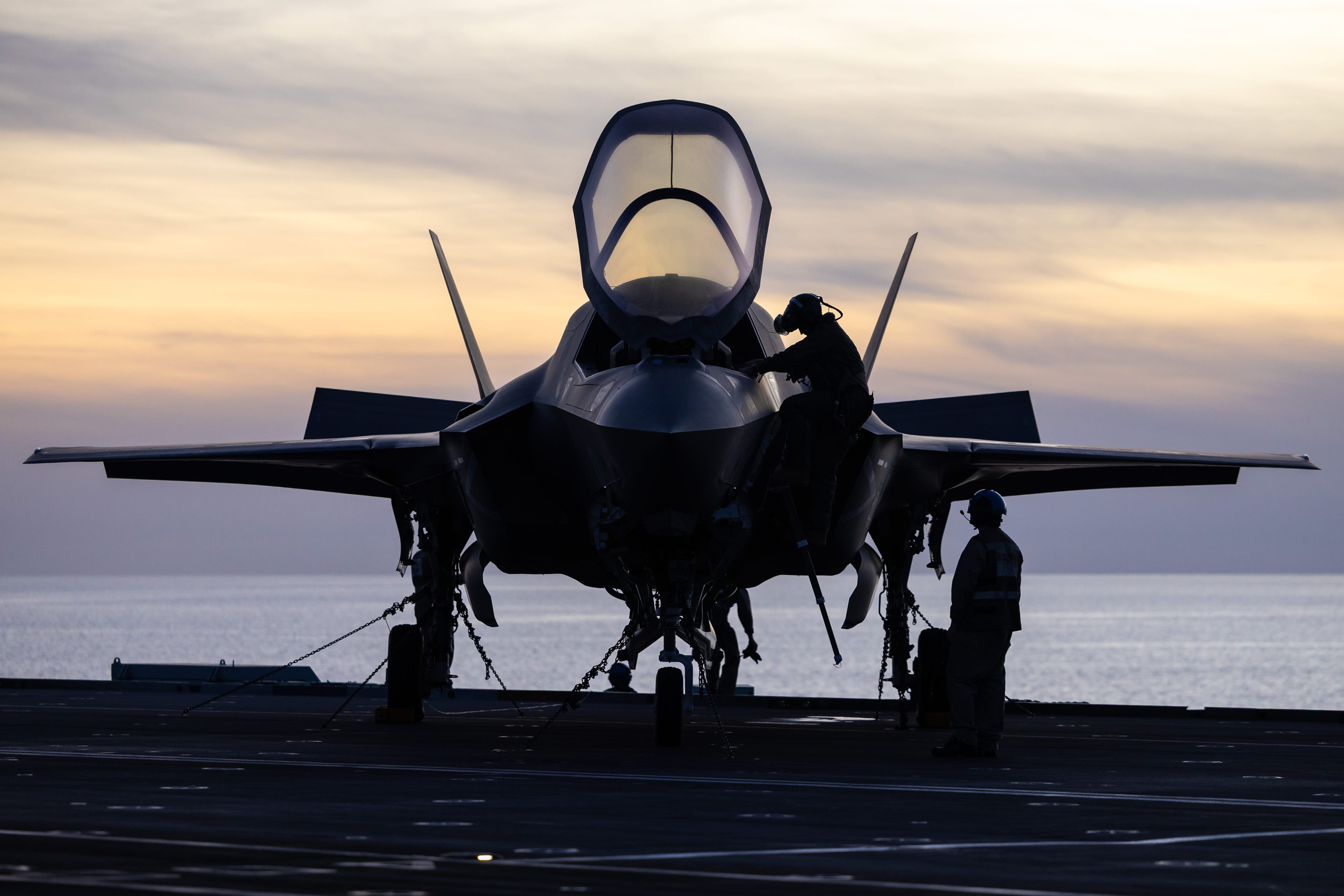 A fighter jet parked on a runway