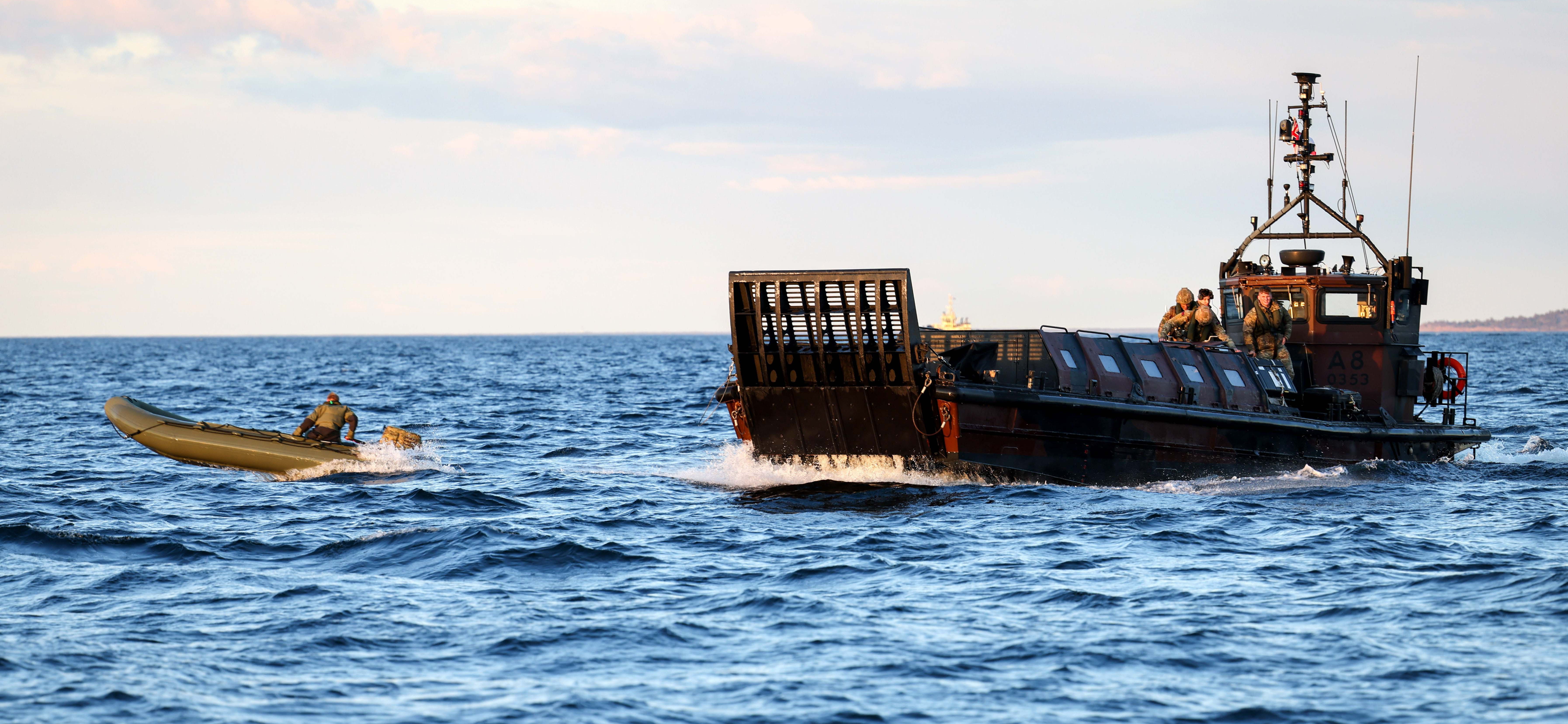 Royal Marine Commandos launching and recovering small boats of commandos from HMS Albion’s large Aft gate