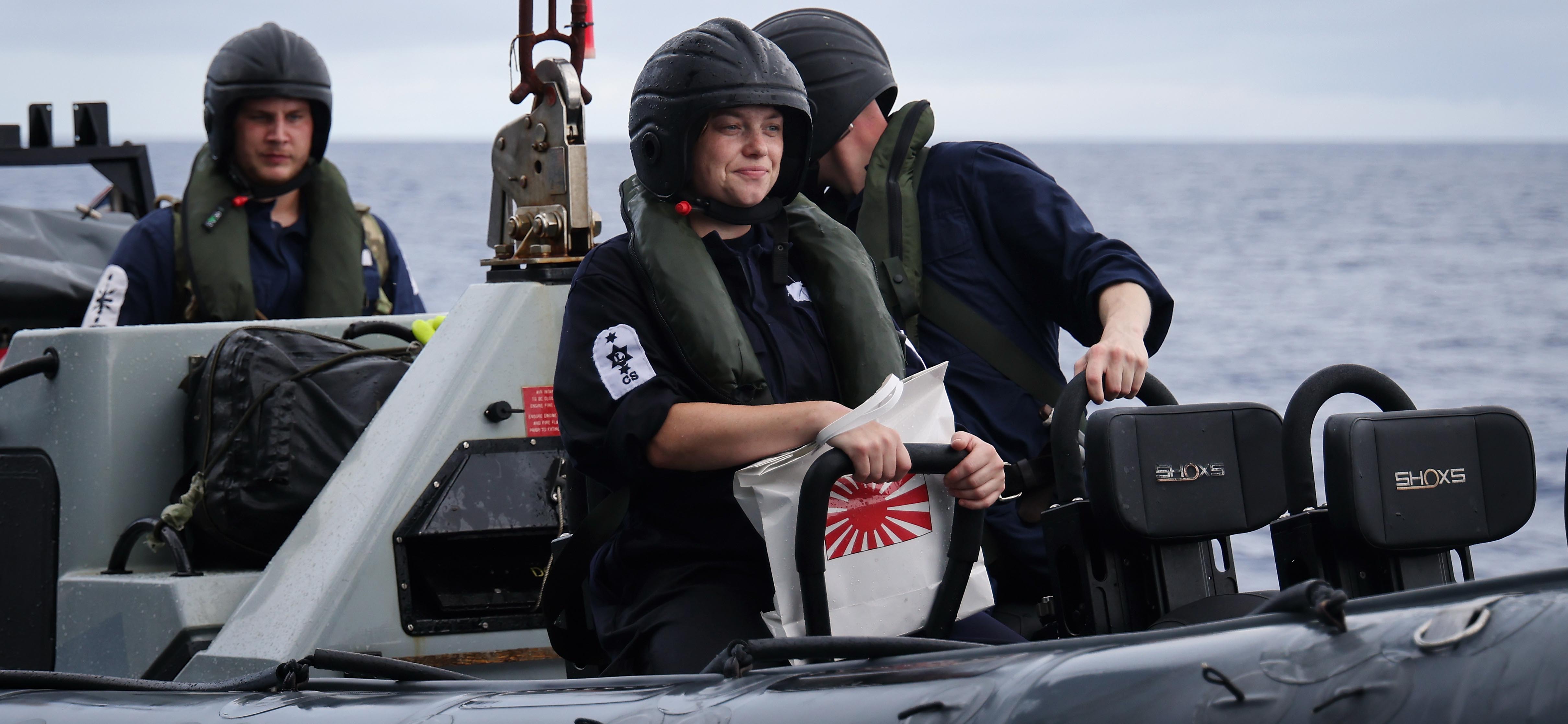 HMS Tamar's seaboat being recovered during a search and rescue exercise off the coast of Palau in the Pacific Ocean.