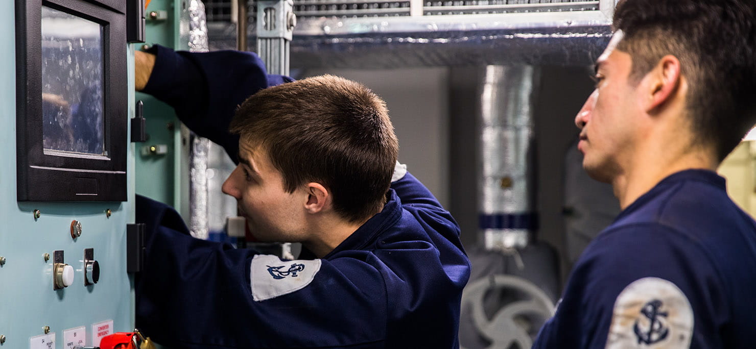 Members of HMS Queen Elizabeth’s Marine Engineering Department fix a defect on one of her propulsion drives.
