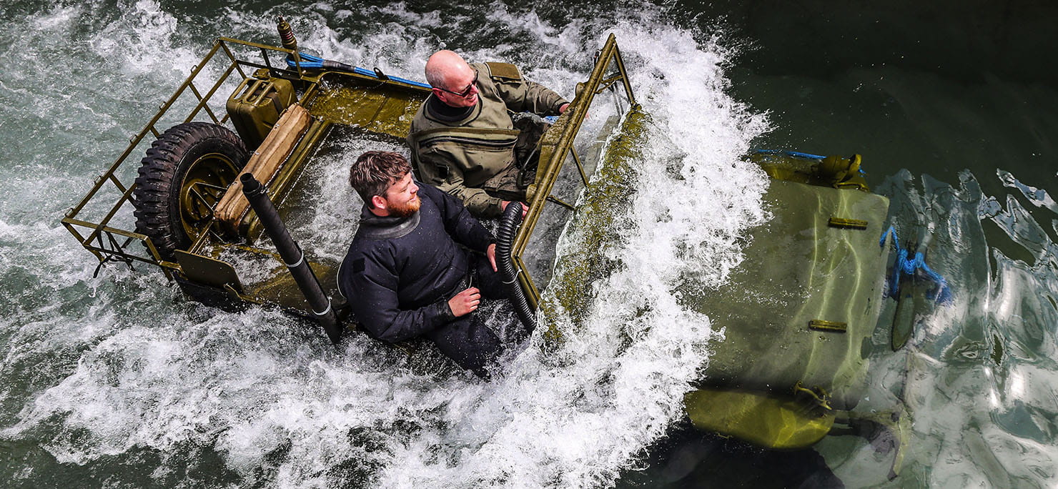 WW2 Willys jeep going through the dip tank, fording to a depth of 1.5m
