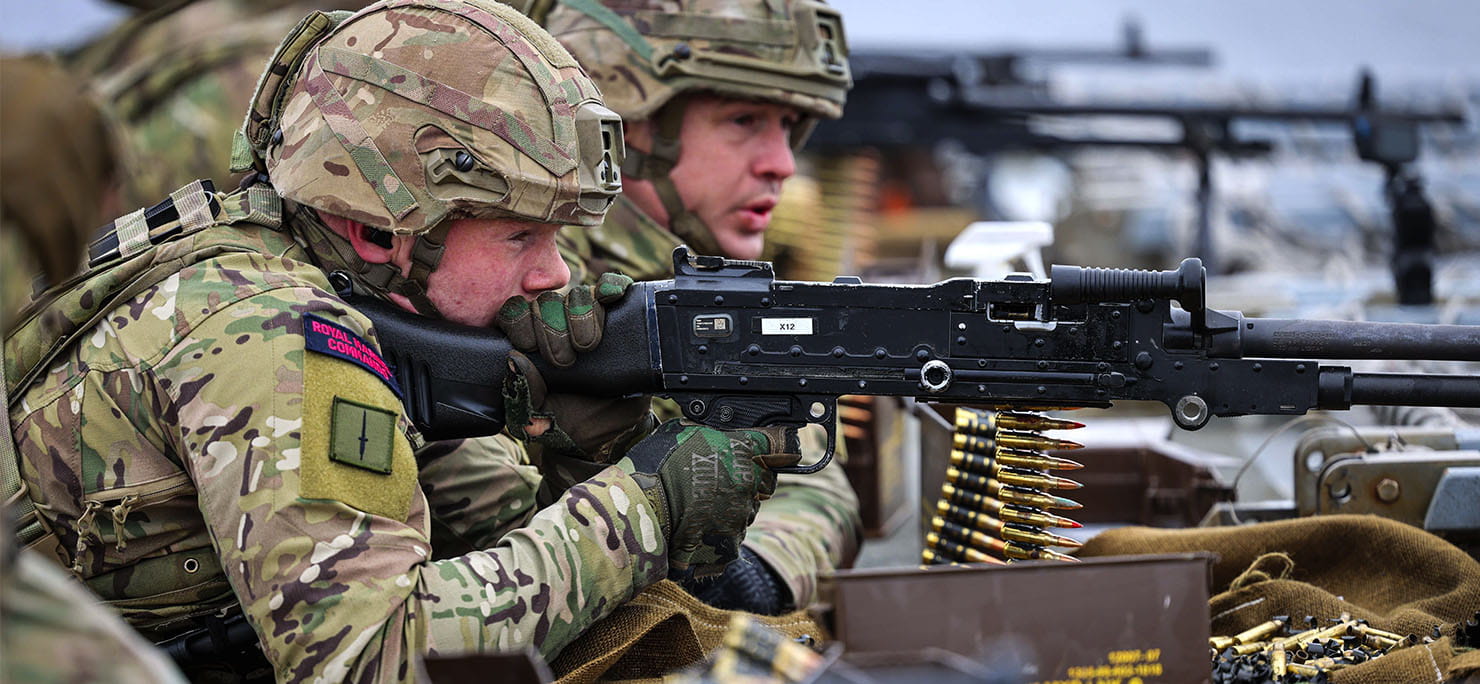 X Company 45 Commando Royal Marines shooting their GPMG’s from the aft end of HMS Albion in the Baltic Sea