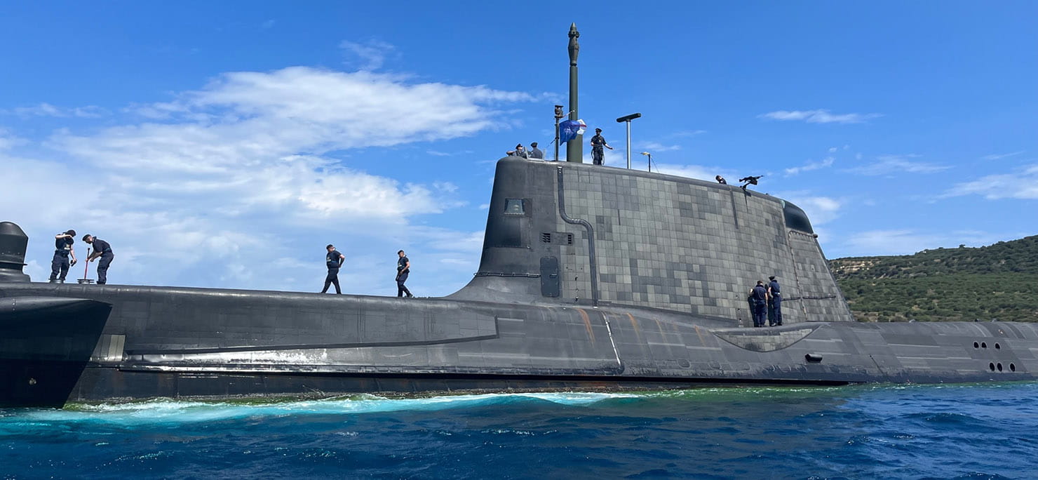 HMS Audacious departs Souda Bay in Crete ahead of NATO training and operations in the Mediterranean.