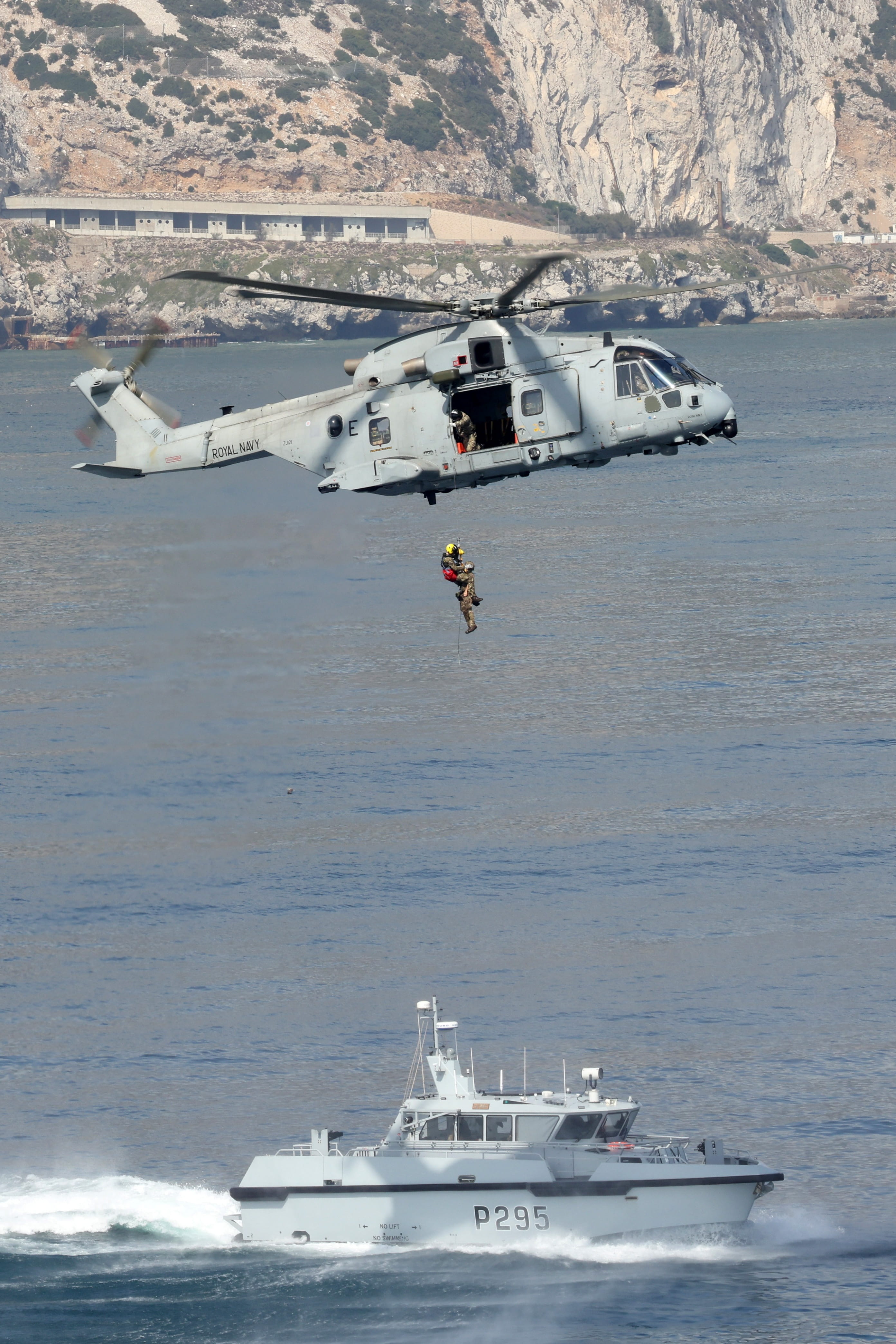 HMS Cutlass engaging in a search and rescue training exercise with Merlin helicopter